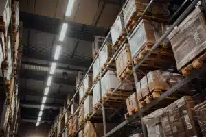 An industrial warehouse filled with shelves of neatly organized nuts and bolts.
