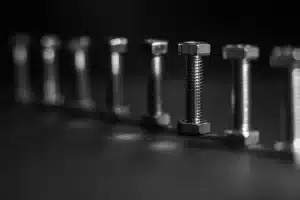 Precision in alignment: Bolts arranged in a perfect line.